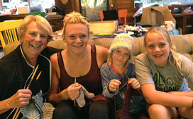 Bev Kjeldsen (NoCal Dame) and her granddaughters knitting scarves and helmet liners for our troops